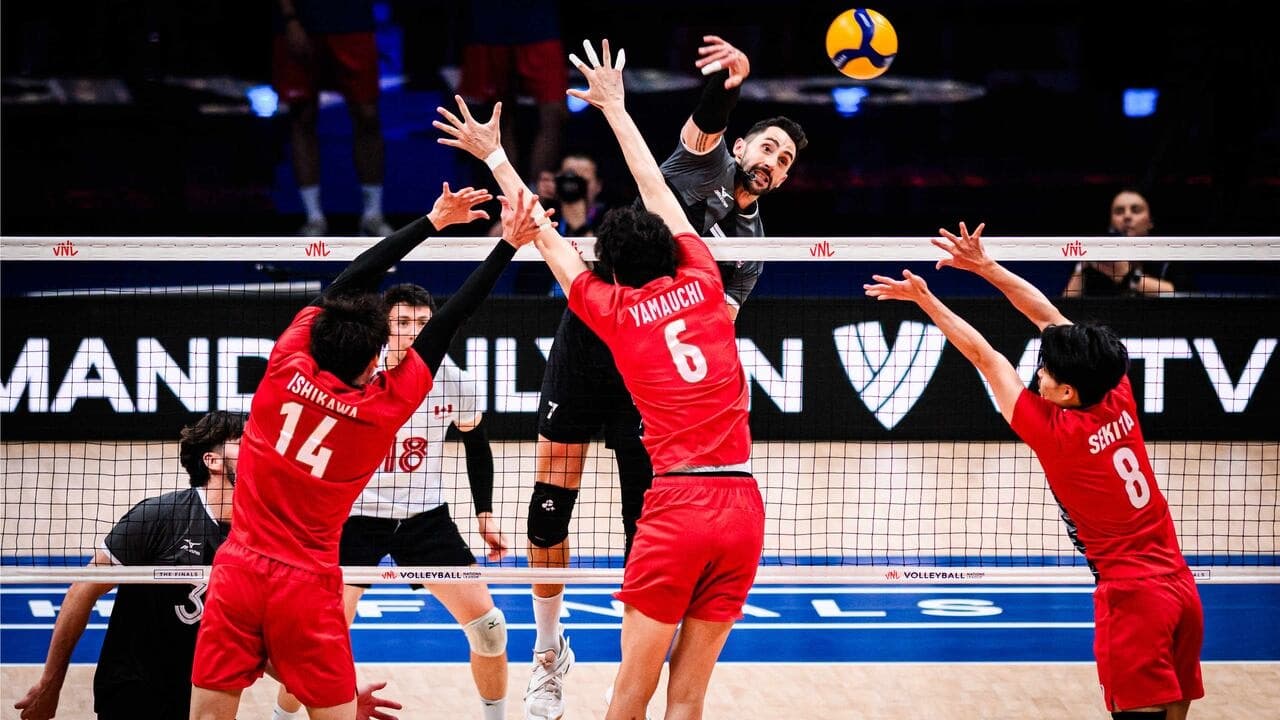 Indoor volleyball game in motion